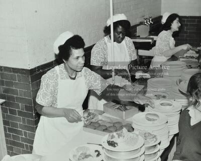 Barnsbury Girls School: dinner ladies serve lunch to  students.