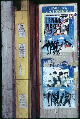 A torn Flying Pickets poster over a poster of the band Madness